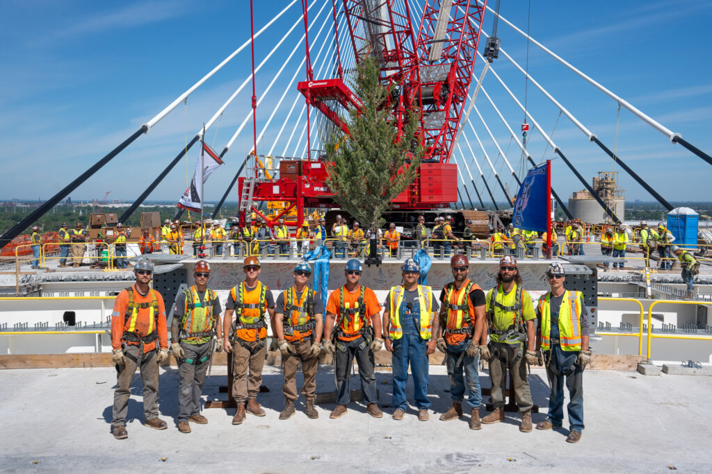 Celebrating the hands helping build - Flag & crane