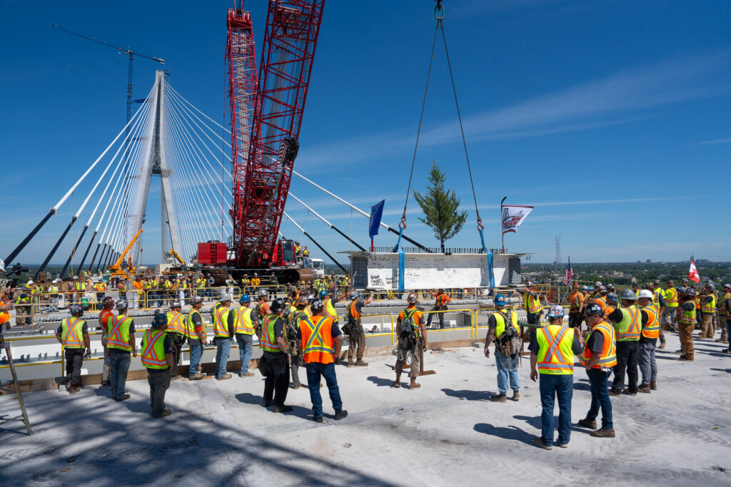 Celebrating the hands helping build - Flag & crane