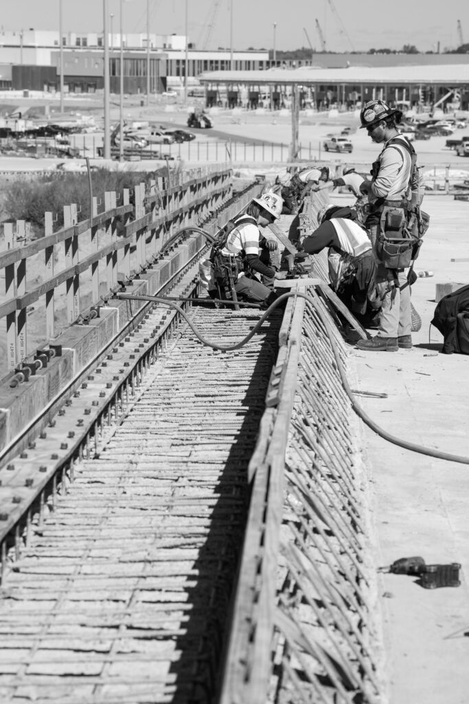 construction workers in black and white
