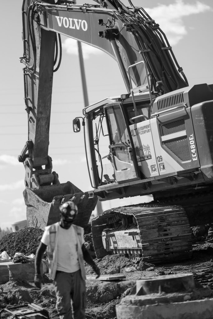 black and white image of excavator