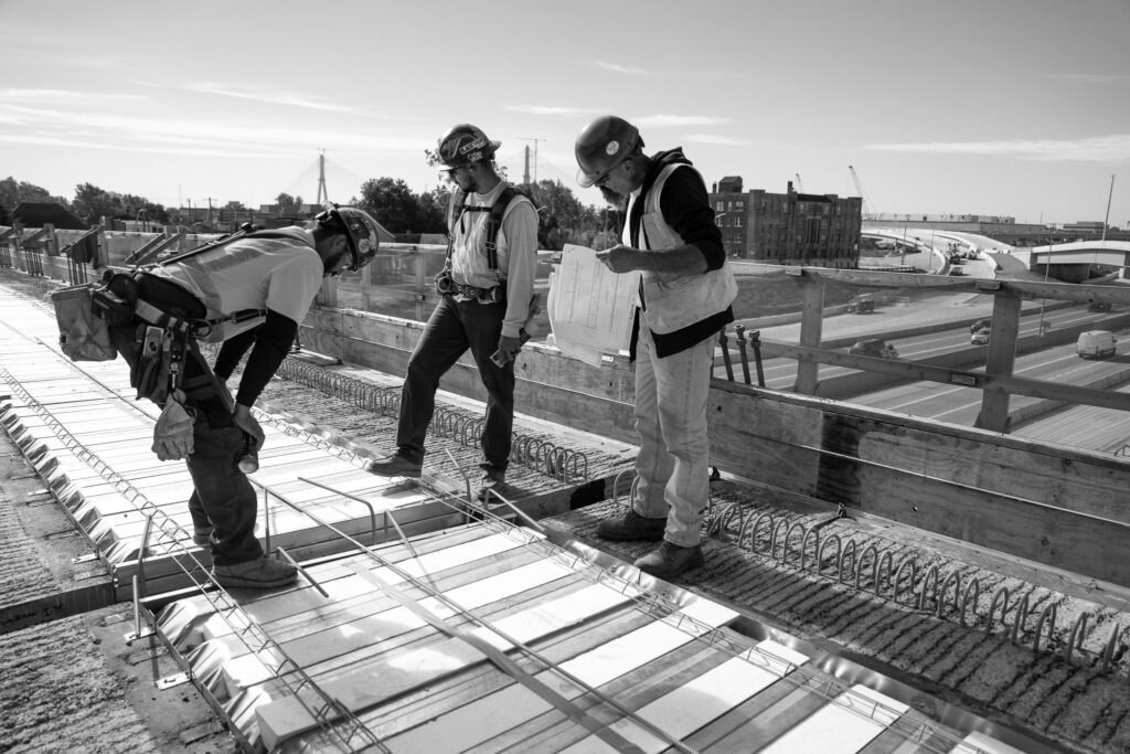 construction workers in black and white