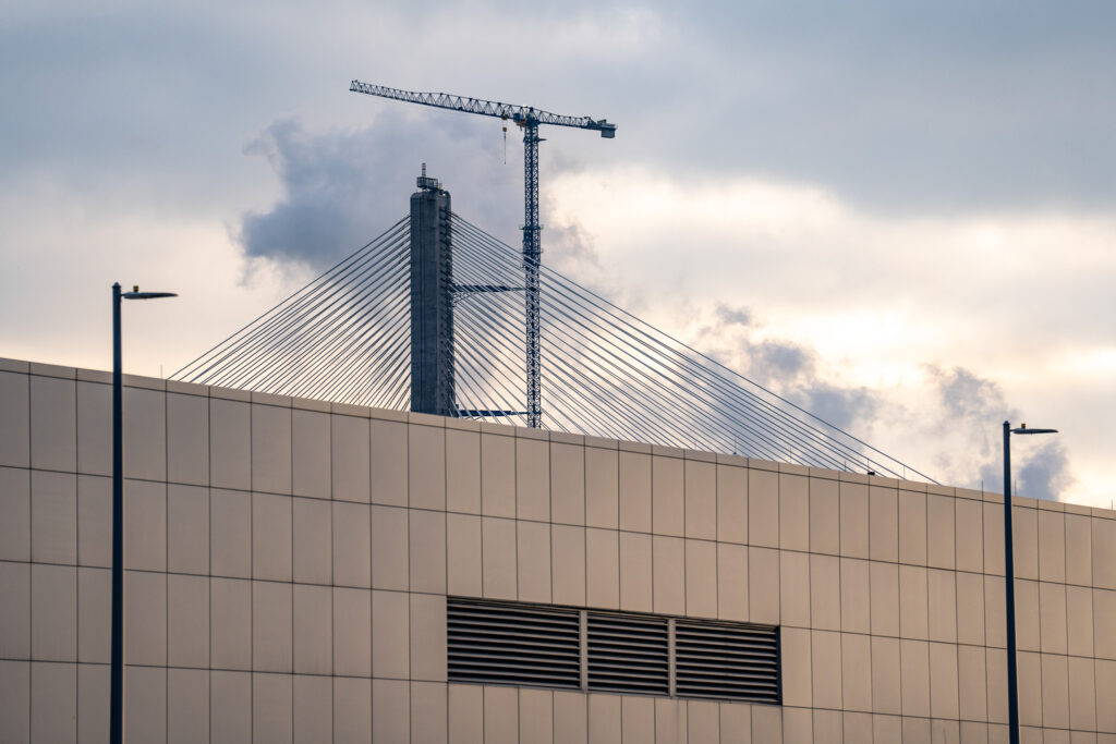 mast peeking over building