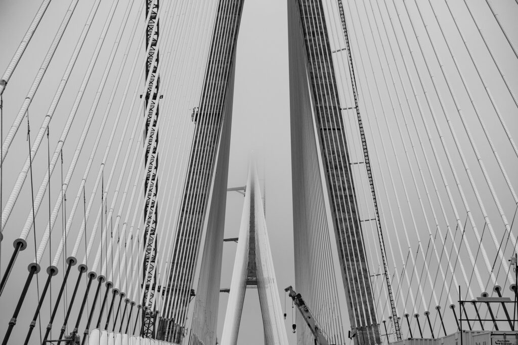clouds surrounding the suspension cables
