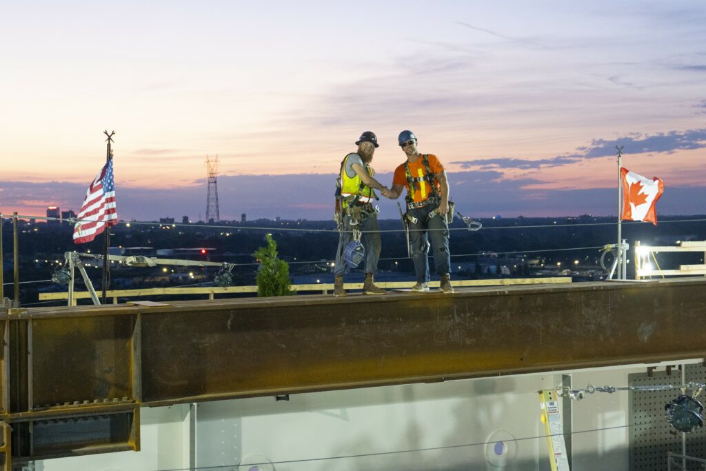 Iron workers shaking hands