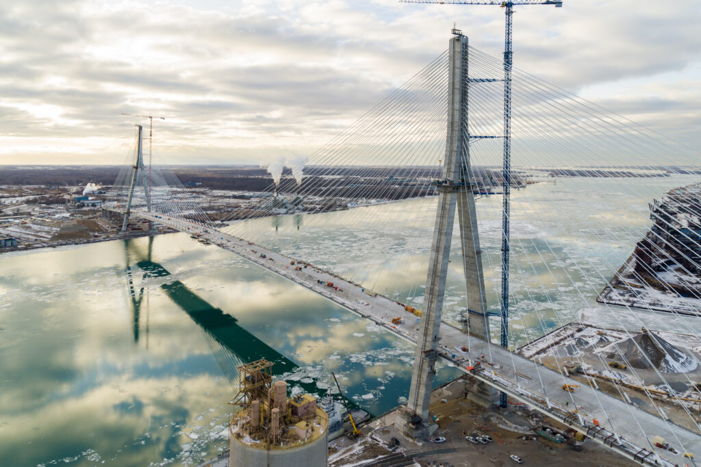 Image of whole bridge in winter conditions and ice in river