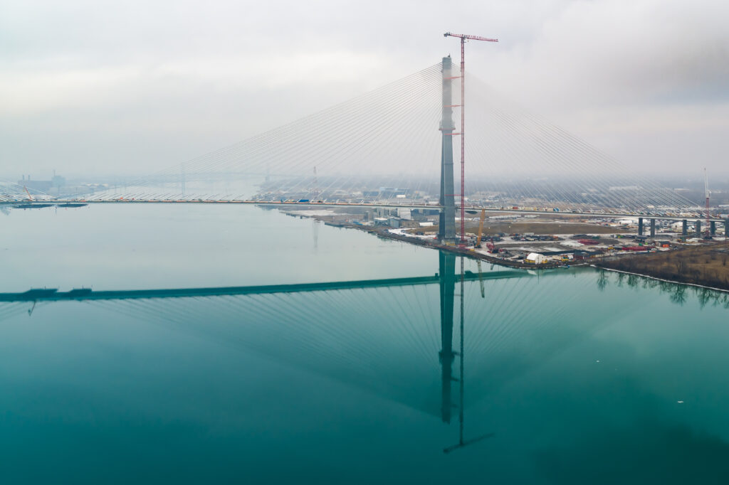Horizontal view of bridge with a mirror image from the river