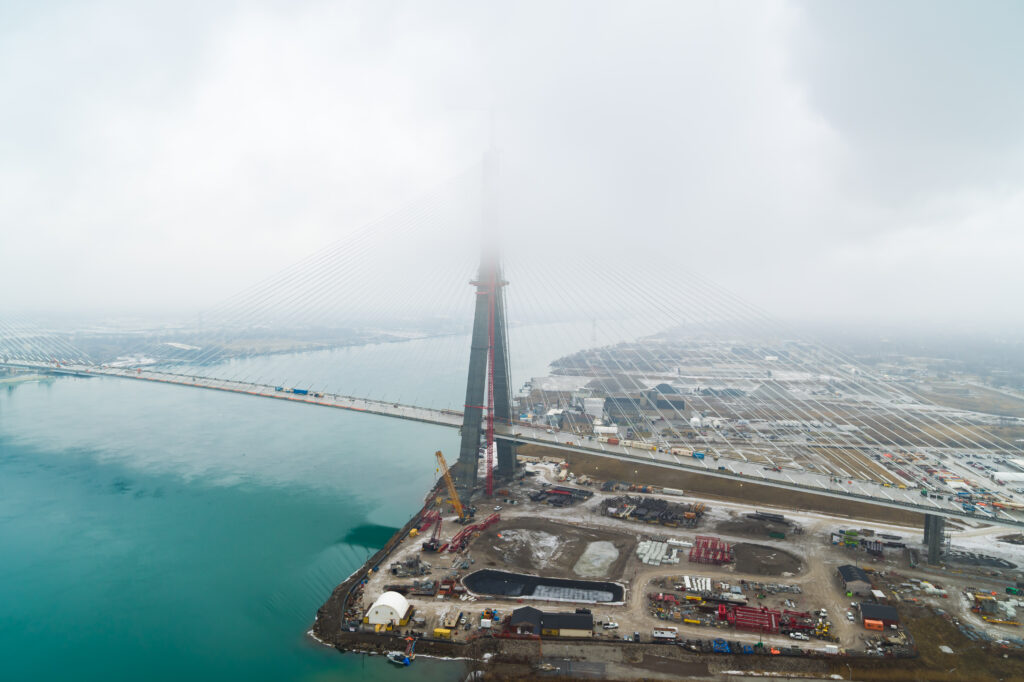 Image of bridge mast with clouds covering the top
