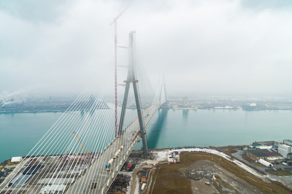 View of the whole bridge with clouds around the mast