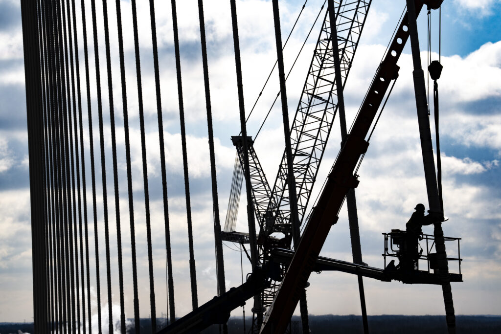 Worker working on the suspension cable