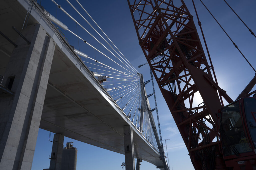 Looking up from under the bridge with crane in view