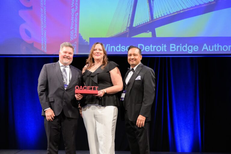 Photo of two WDBA Employees accepting the OACETT Award